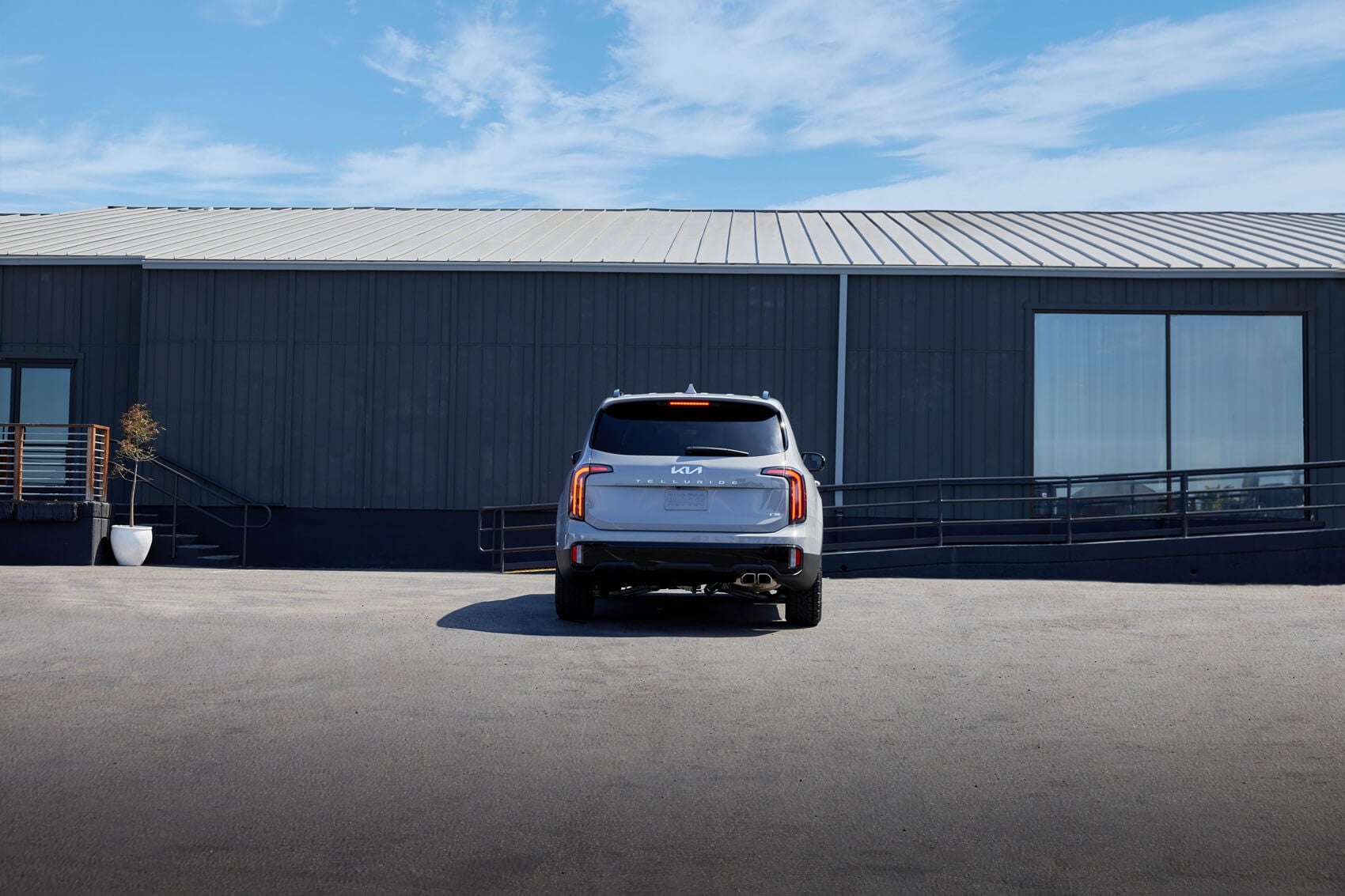 Kia Telluride parked in front of building